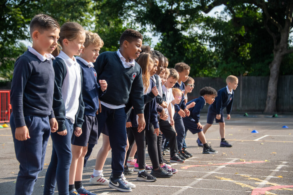 a picture of students getting ready to run on the playground