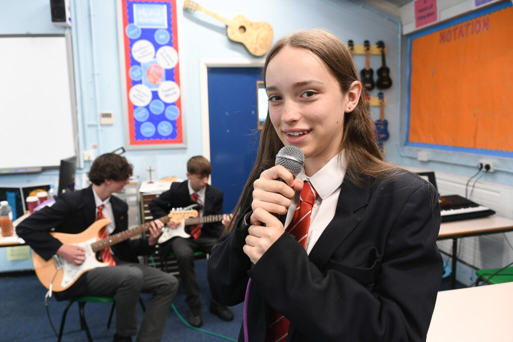 a close up of a student singing